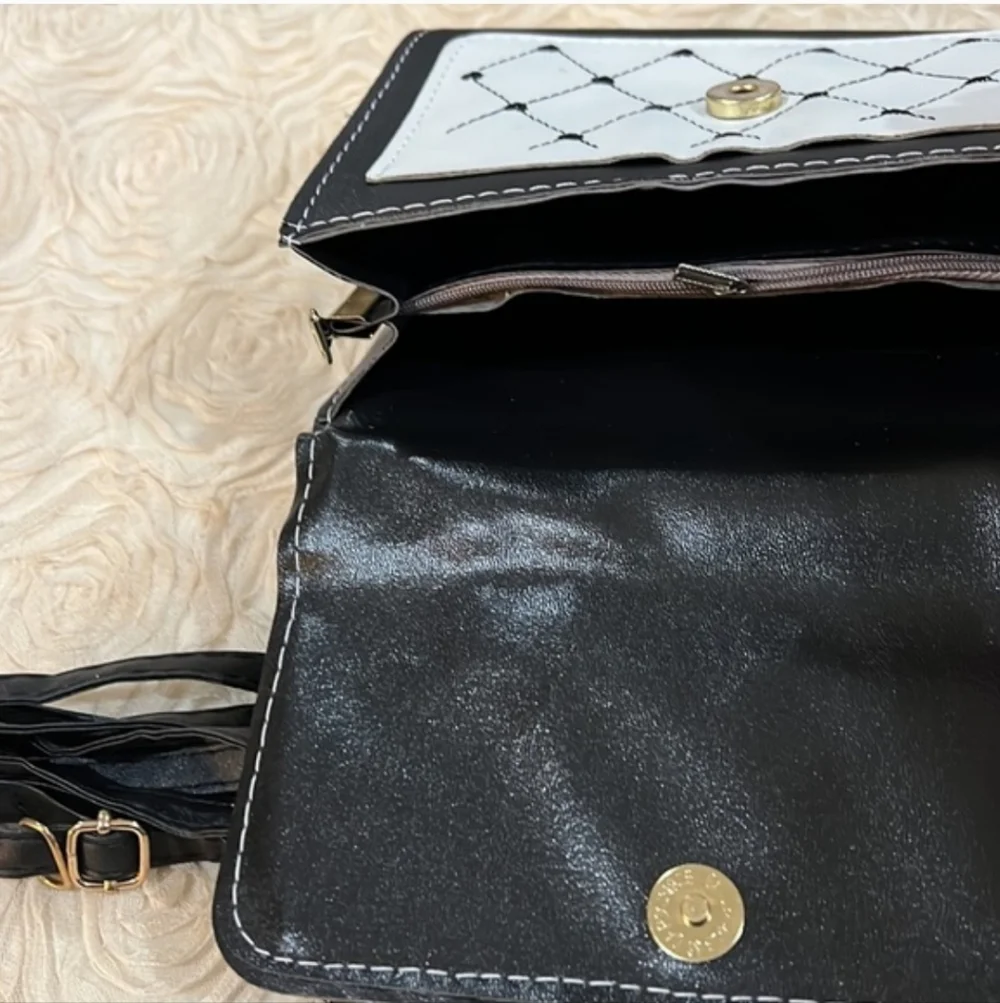 Elegant Black and White Crossbody Bag with Bee Detail